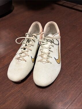 Nike Cream Soccer Cleats with Gold Swoosh and Peach Accents